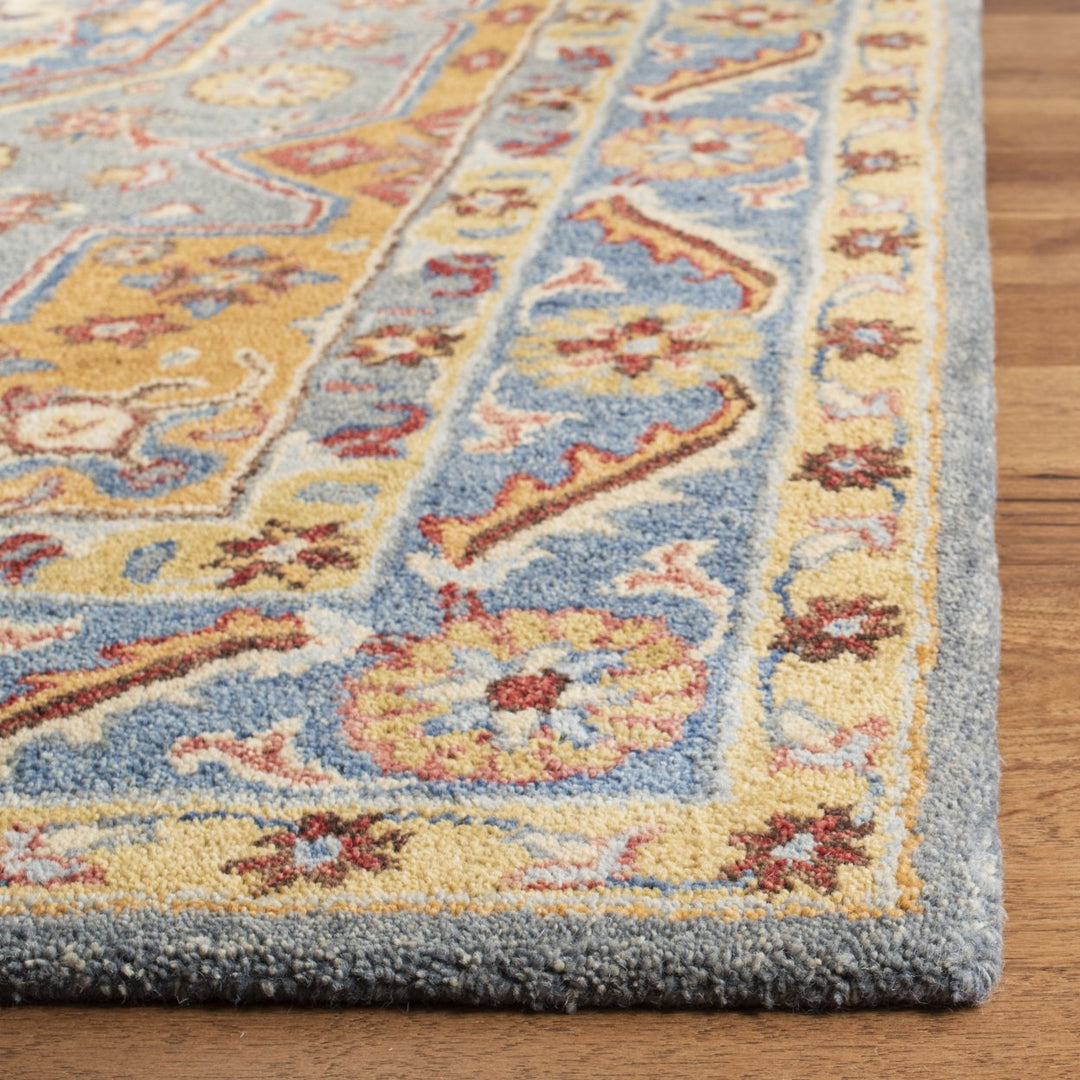 SAFAVIEH Antiquity AT504M Handmade Blue / Gold Rug Image 10