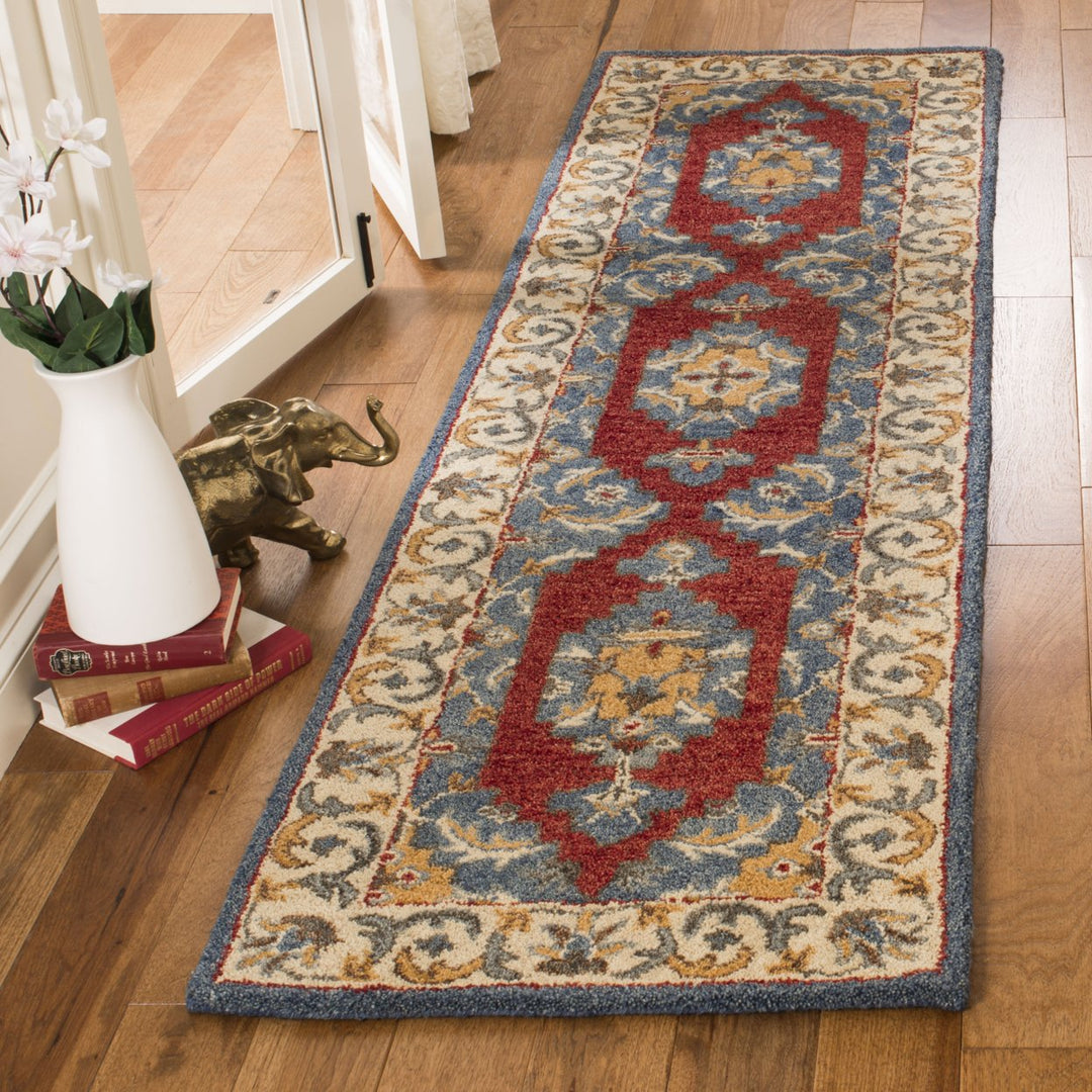 SAFAVIEH Antiquity AT505M Handmade Blue / Red Rug Image 9