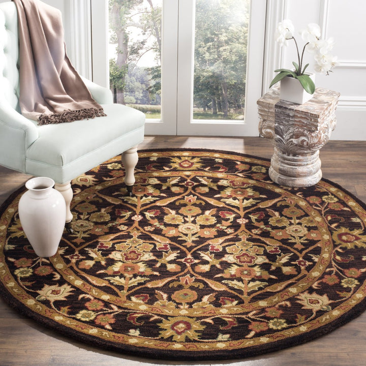 SAFAVIEH Antiquity AT51B Handmade Dark Plum / Gold Rug Image 9