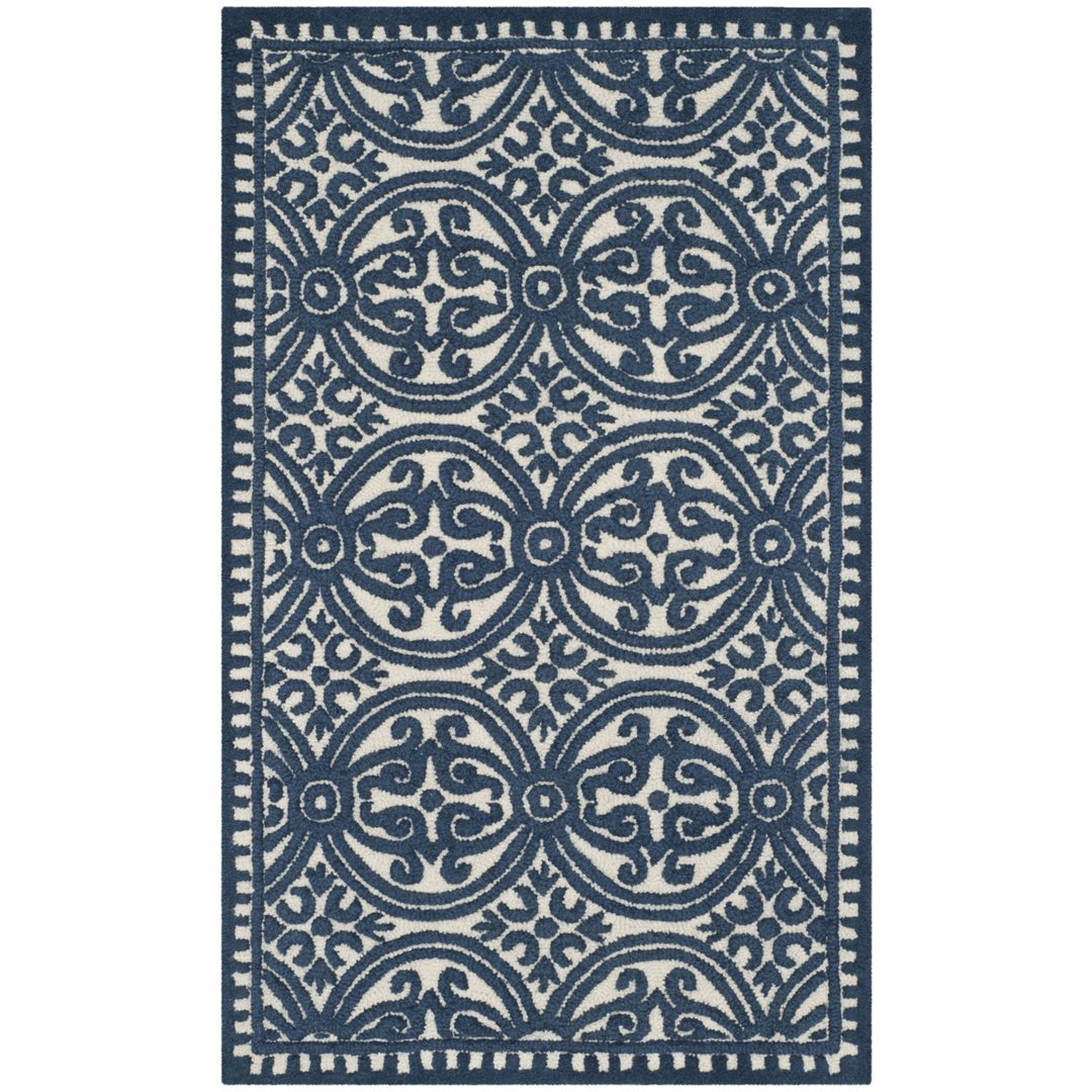 SAFAVIEH CAM232B Cambridge Ivory / Navy Image 1