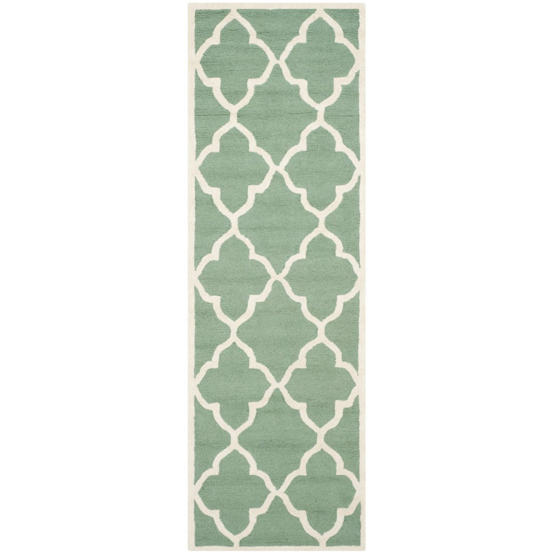 SAFAVIEH Cambridge CAM312T Handmade Teal / Ivory Rug Image 1