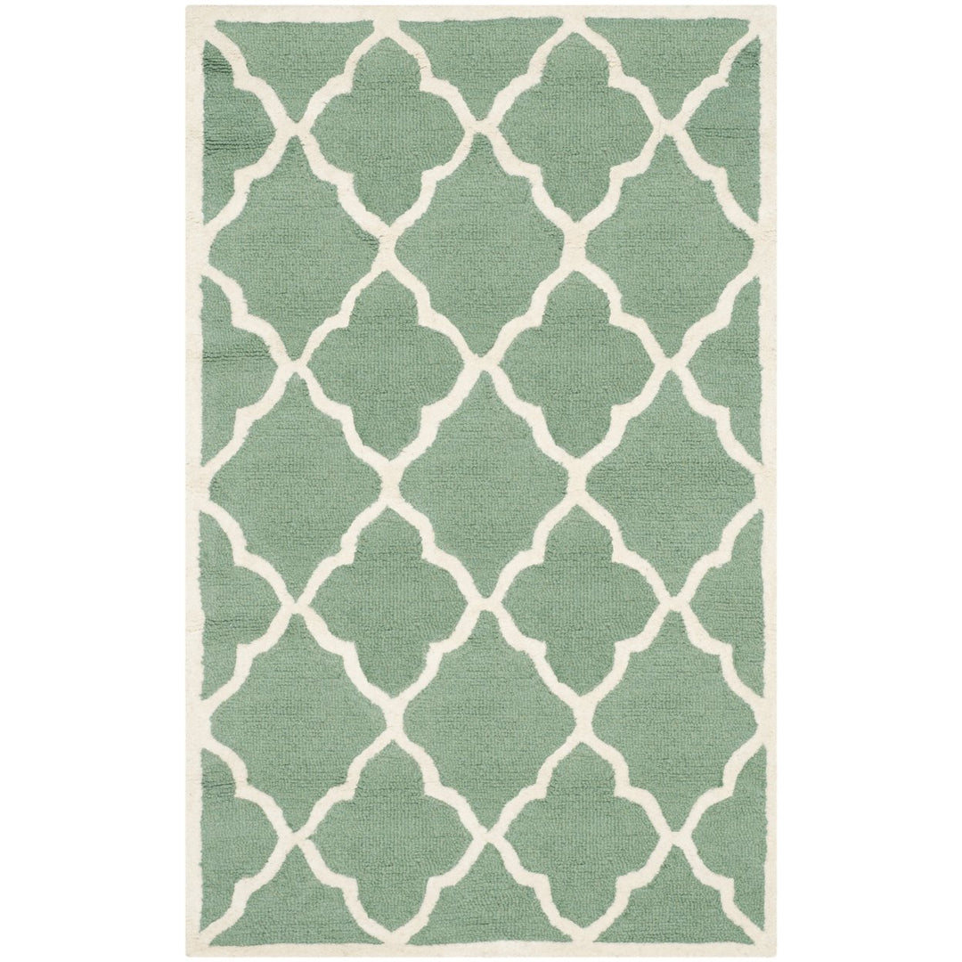 SAFAVIEH Cambridge CAM312T Handmade Teal / Ivory Rug Image 1