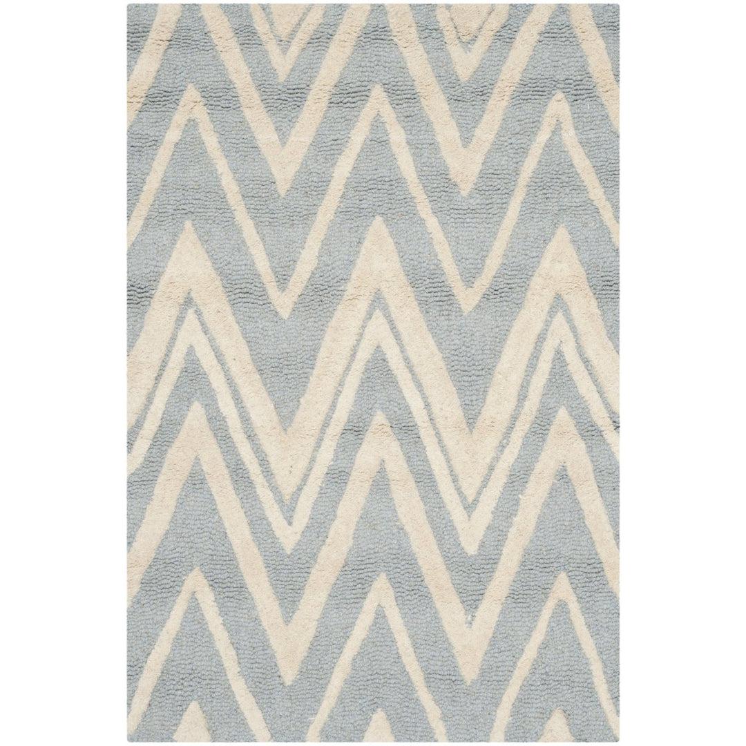 SAFAVIEH Cambridge CAM711B Handmade Blue / Ivory Rug Image 1