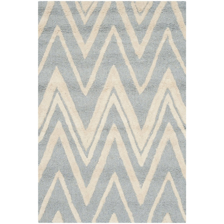 SAFAVIEH Cambridge CAM711B Handmade Blue / Ivory Rug Image 1