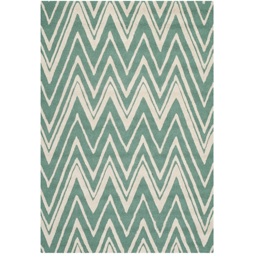 SAFAVIEH Cambridge CAM711T Handmade Teal / Ivory Rug Image 1