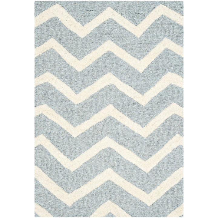 SAFAVIEH Cambridge CAM714B Handmade Blue / Ivory Rug Image 1