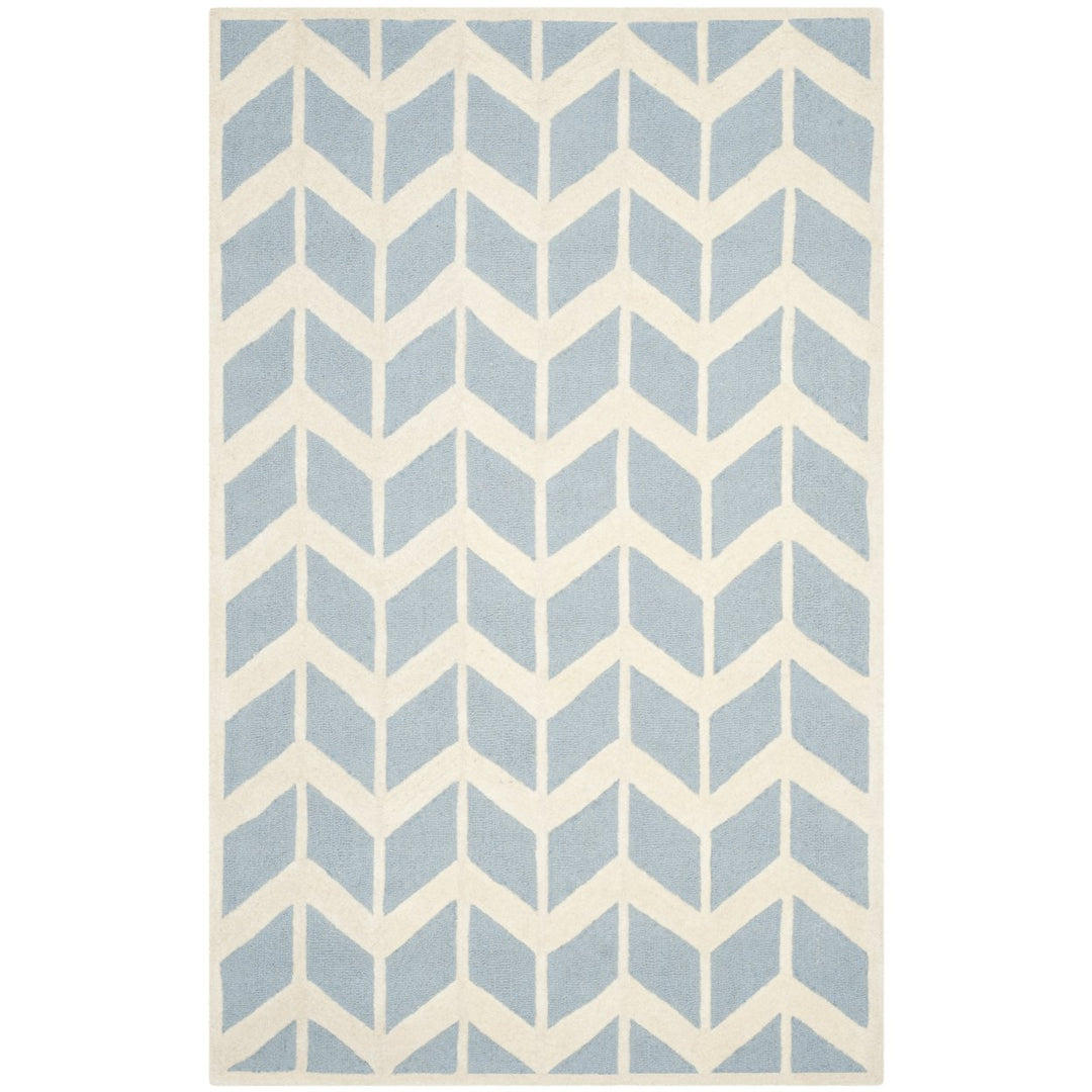 SAFAVIEH Cambridge CAM718B Handmade Blue / Ivory Rug Image 1