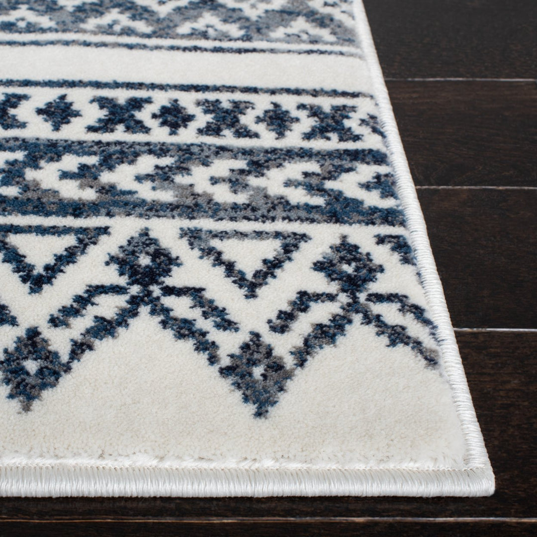 SAFAVIEH Carnegie Collection CNG620N Ivory / Navy Rug Image 4