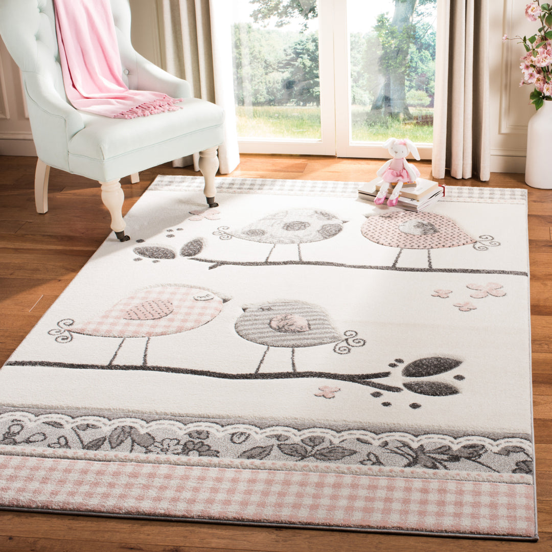 SAFAVIEH Carousel Kids Collection CRK153P Pink/Ivory Rug Image 1