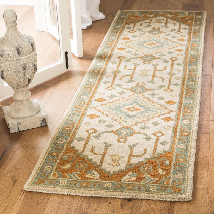 SAFAVIEH Heritage HG406A Handmade Light Blue / Rust Rug Image 3