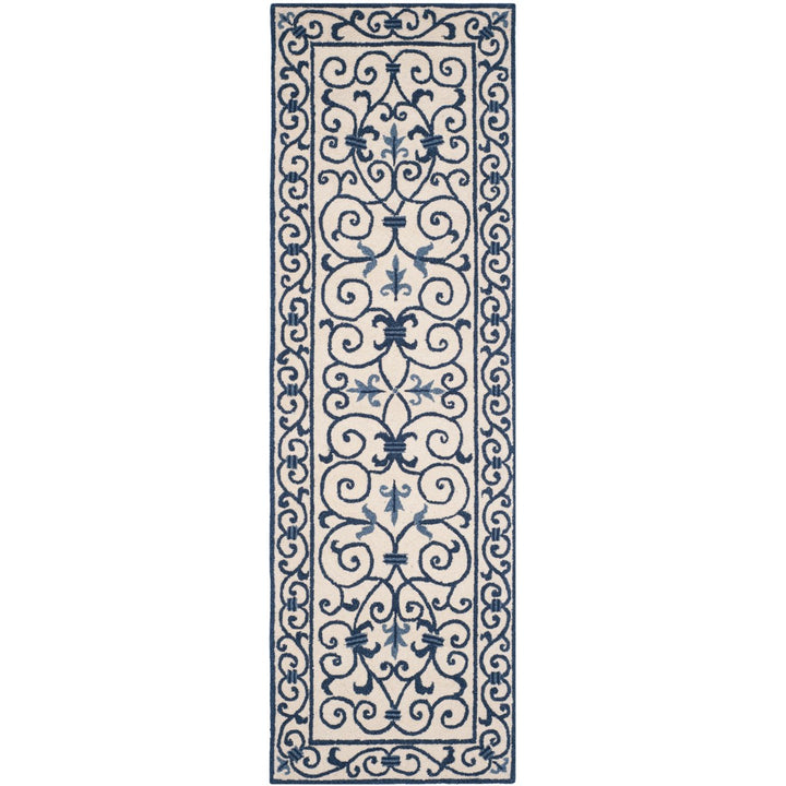 SAFAVIEH Chelsea HK11I Hand-hooked Ivory / Dark Blue Rug Image 1