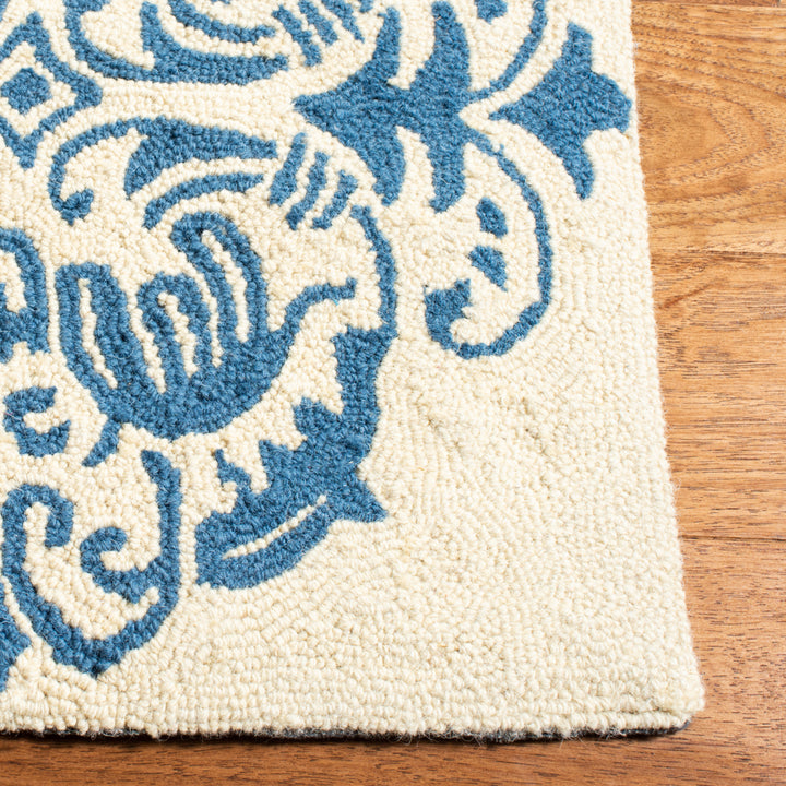 SAFAVIEH Chelsea HK145A Hand-hooked Ivory / Blue Rug Image 11