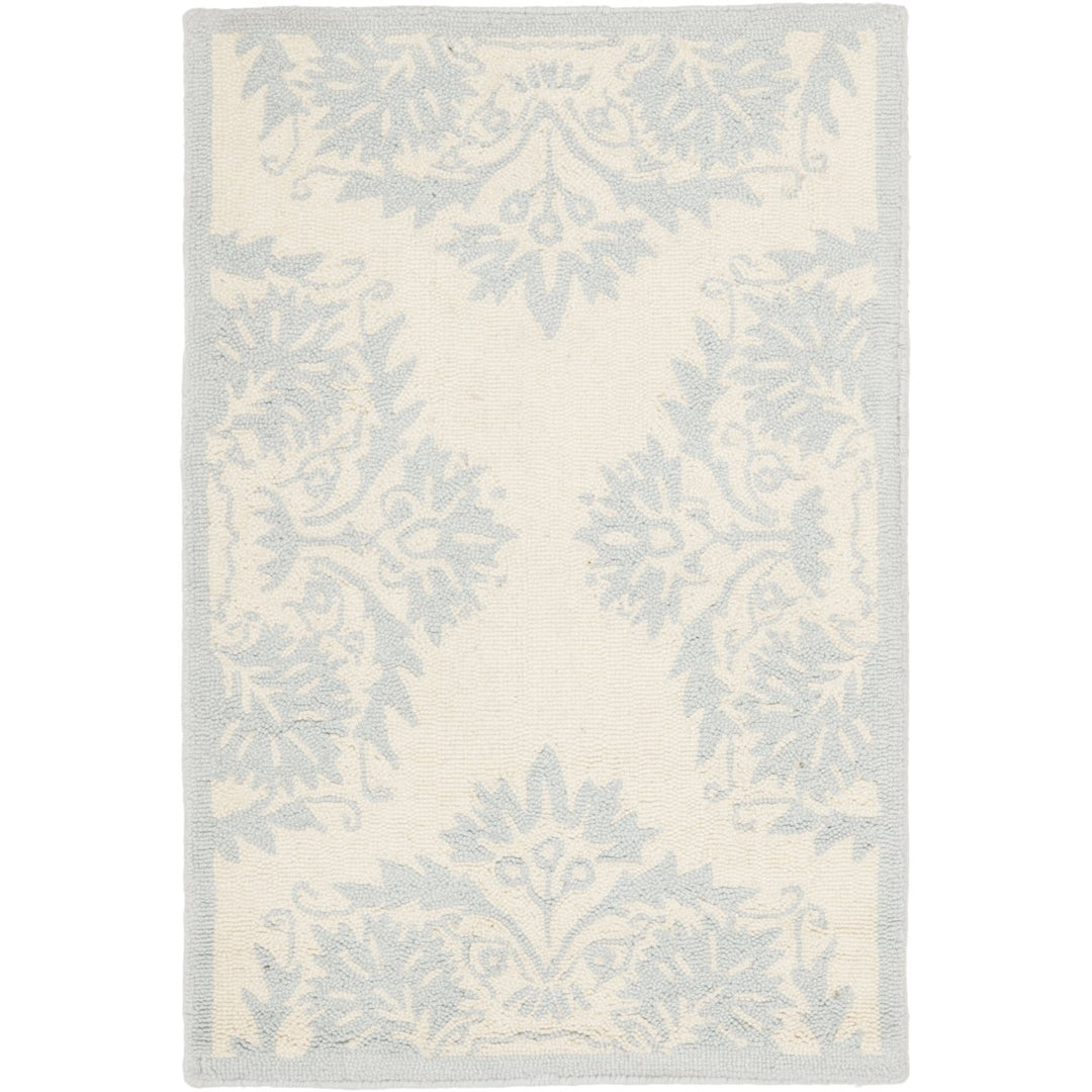 SAFAVIEH Chelsea HK359A Hand-hooked Ivory / Blue Rug Image 1