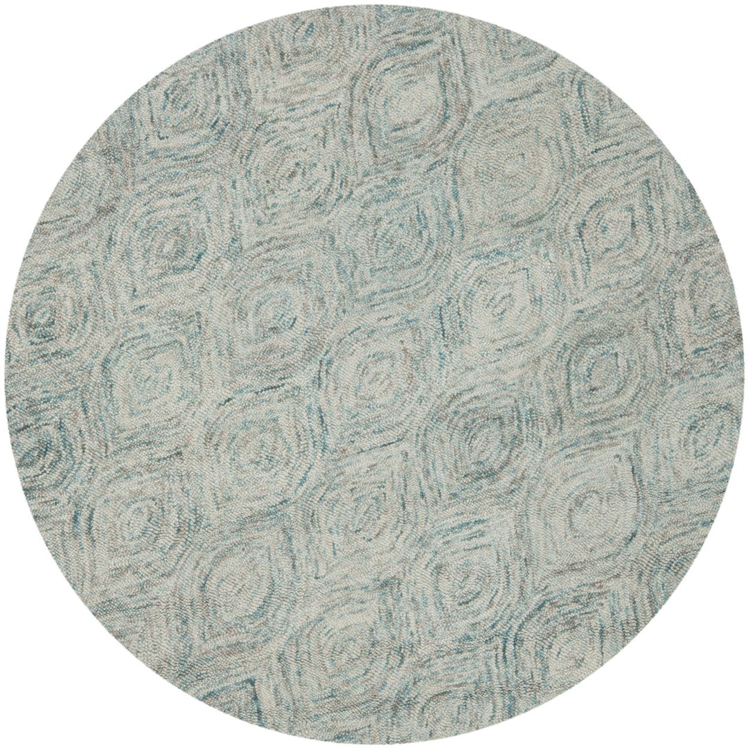 SAFAVIEH Ikat IKT631A Handmade Ivory / Sea Blue Rug Image 1