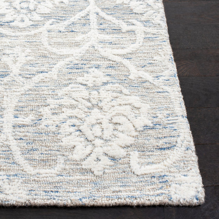 SAFAVIEH Metro MET996L Handmade Light Blue / Ivory Rug Image 10