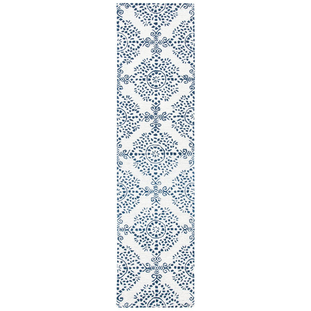 SAFAVIEH Micro-Loop Collection MLP647A Ivory / Blue Rug Image 1