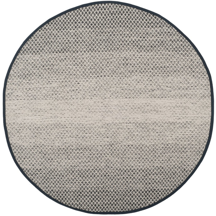 SAFAVIEH Montauk MTK601A Handwoven Black / Ivory Rug Image 1