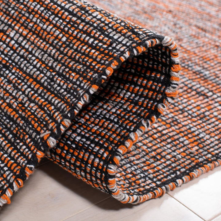 SAFAVIEH Montauk MTK620P Handwoven Orange / Black Rug Image 9