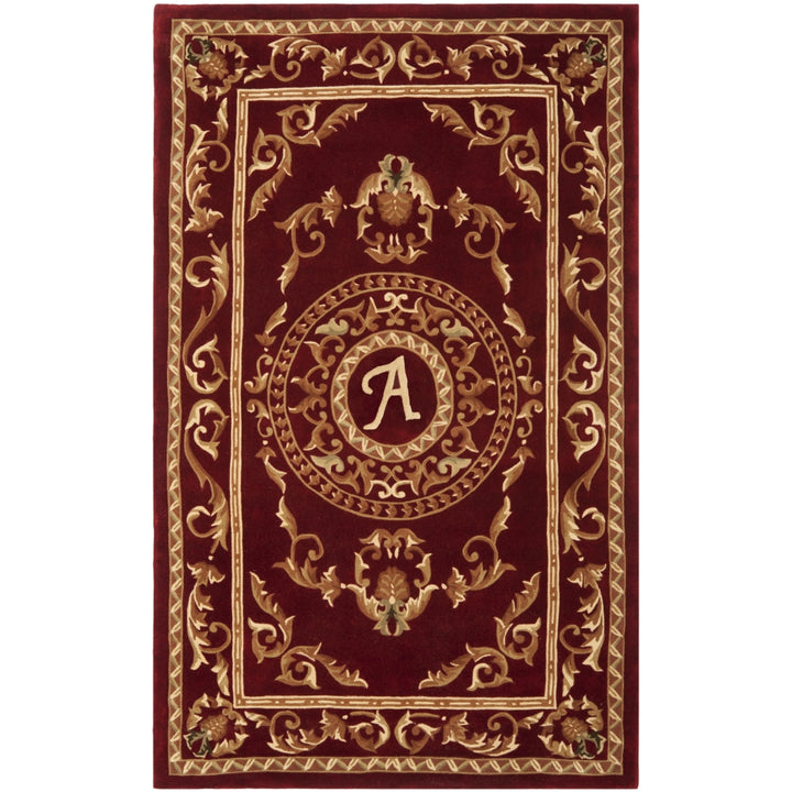 SAFAVIEH Naples Collection NA519A Handmade Burgundy Rug Image 1