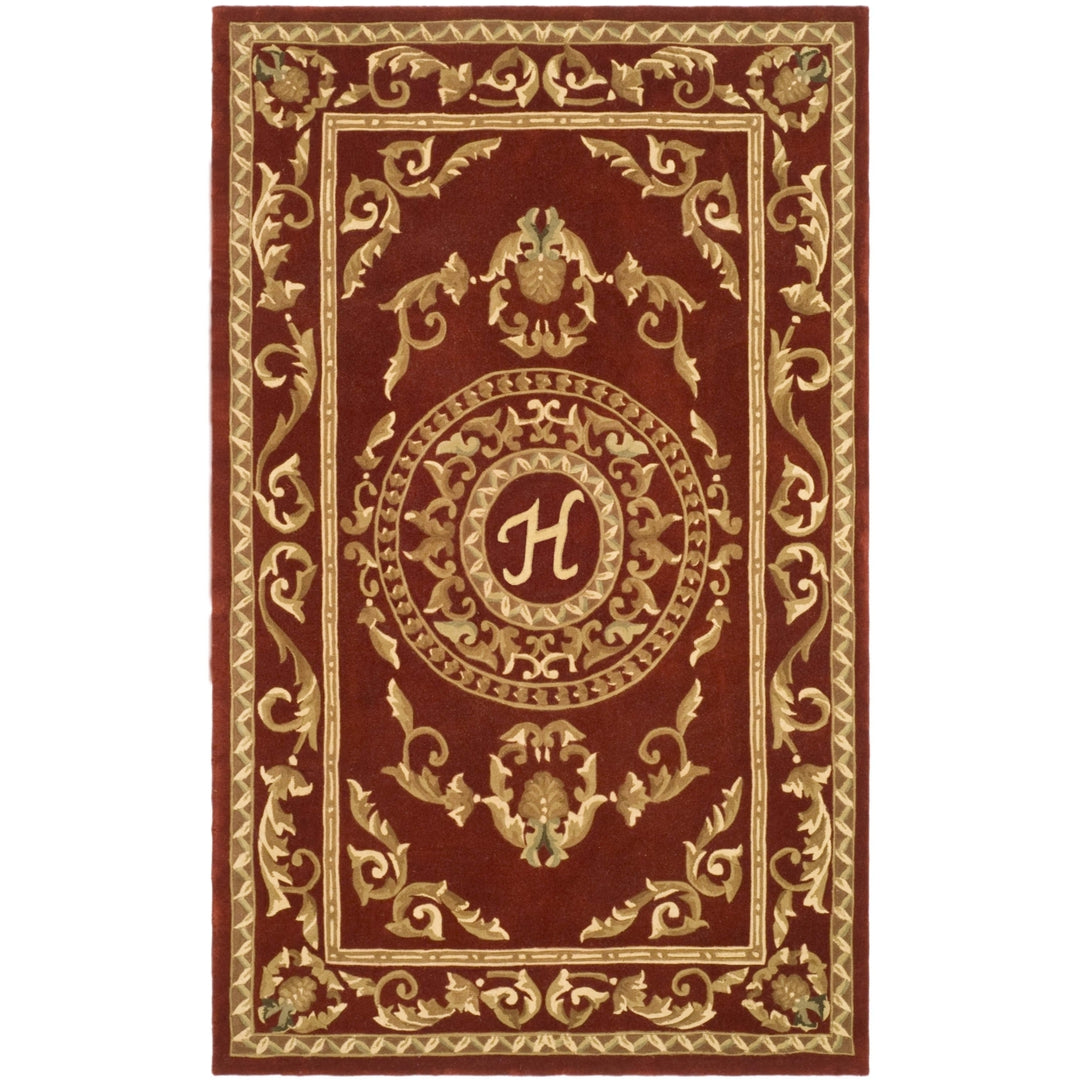 SAFAVIEH Naples Collection NA519H Handmade Burgundy Rug Image 1