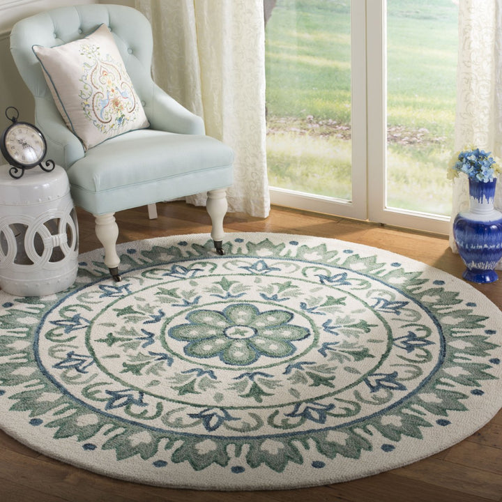 SAFAVIEH Novelty NOV607J Handmade Ivory / Teal Rug Image 1