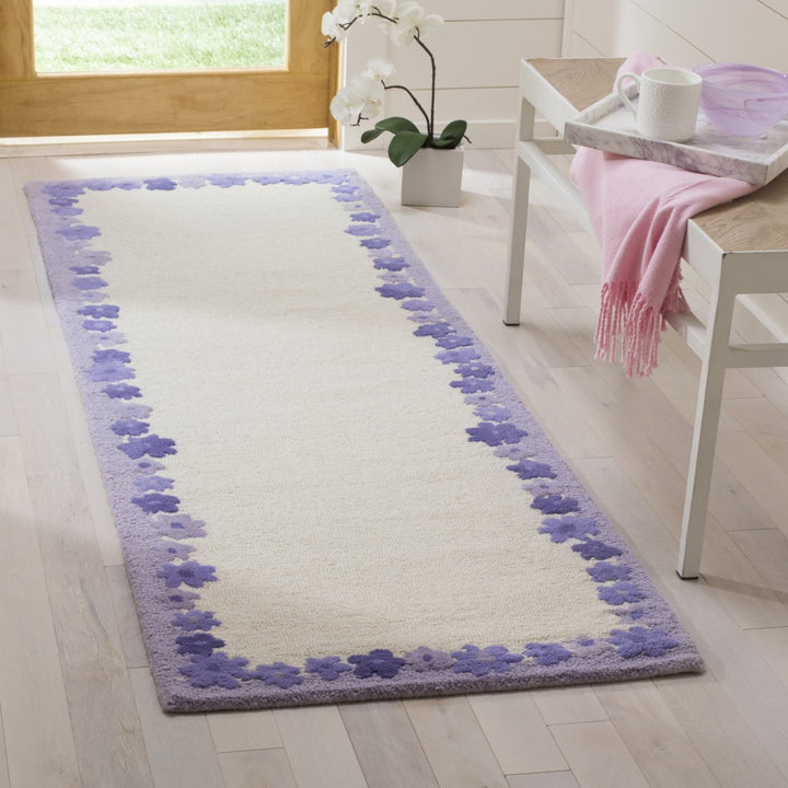 SAFAVIEH Kids SFK357A Handmade Ivory / Lavender Rug Image 3