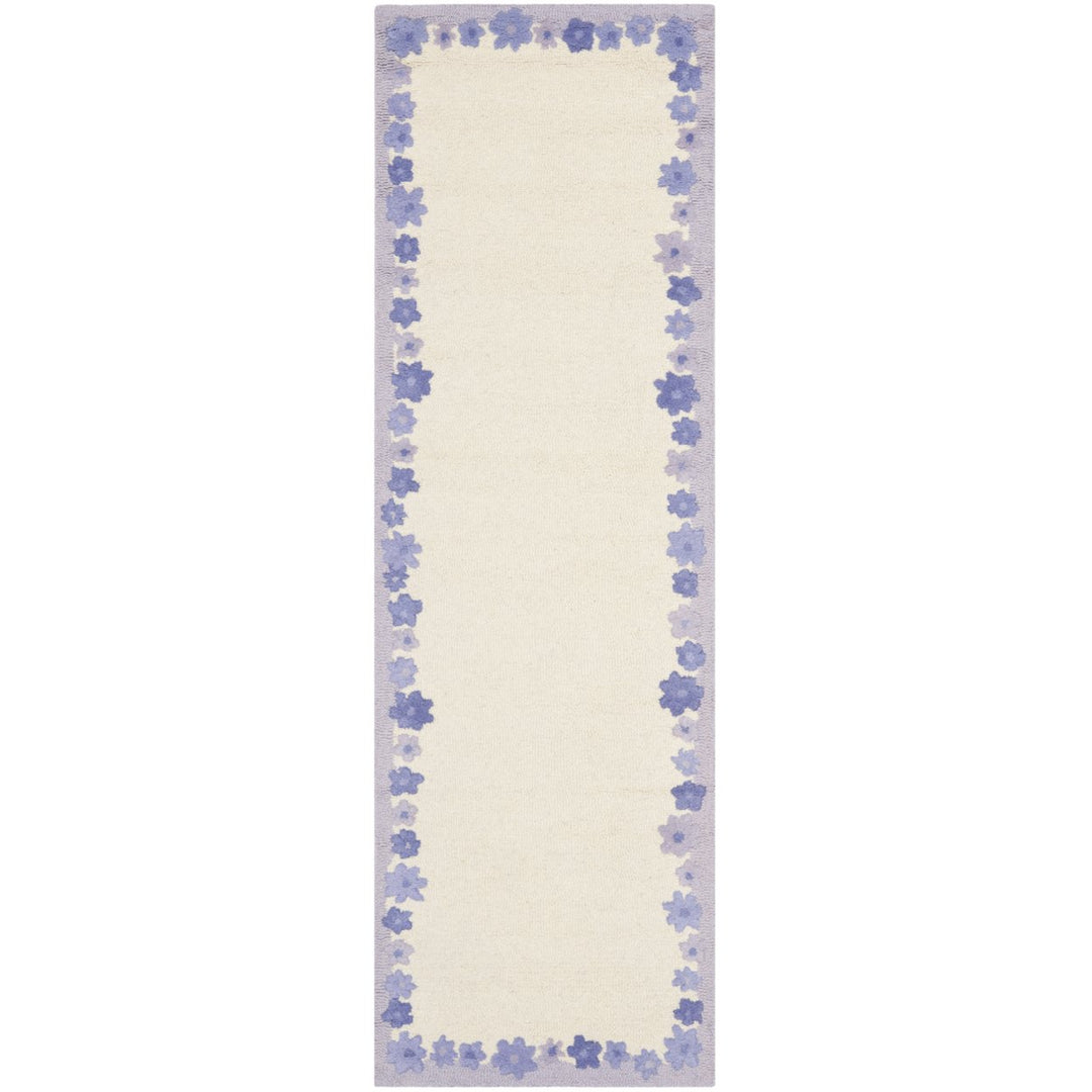 SAFAVIEH Kids SFK357A Handmade Ivory / Lavender Rug Image 1