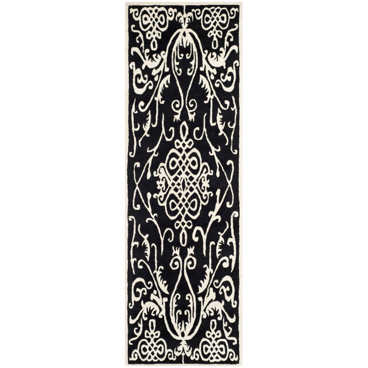 SAFAVIEH Soho SOH120A Handmade Black / Ivory Rug Image 1