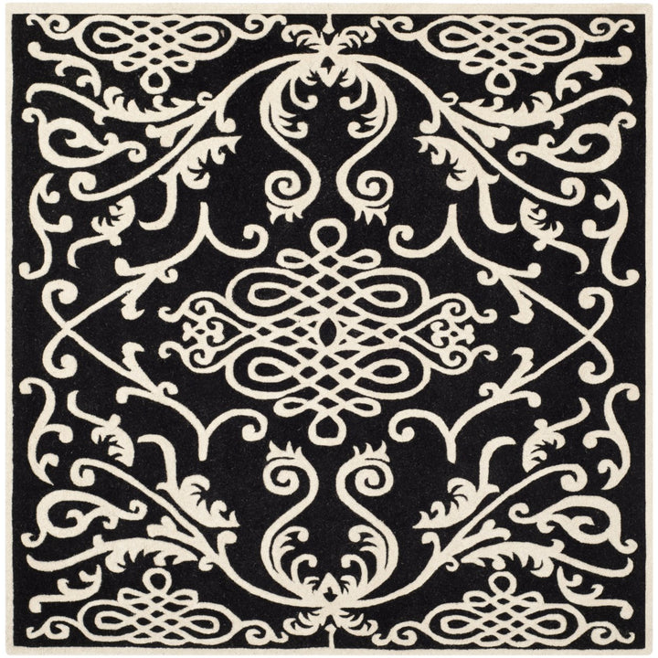 SAFAVIEH Soho SOH120A Handmade Black / Ivory Rug Image 1