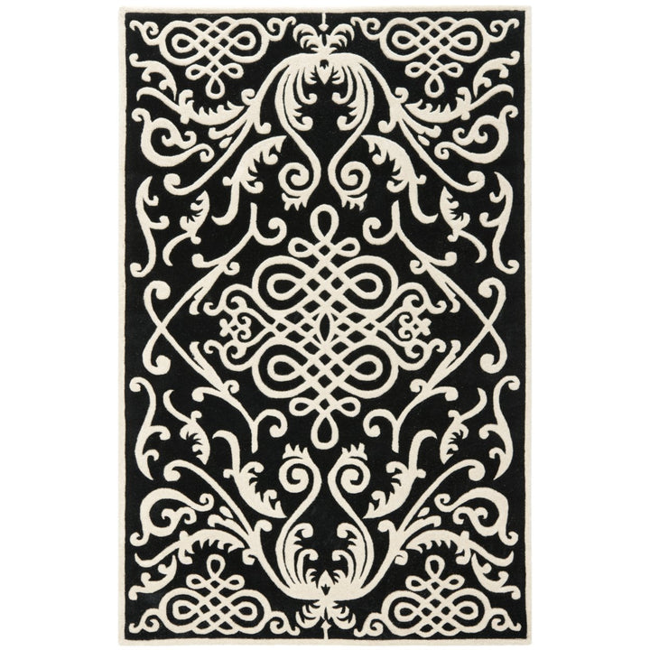 SAFAVIEH Soho SOH120A Handmade Black / Ivory Rug Image 1