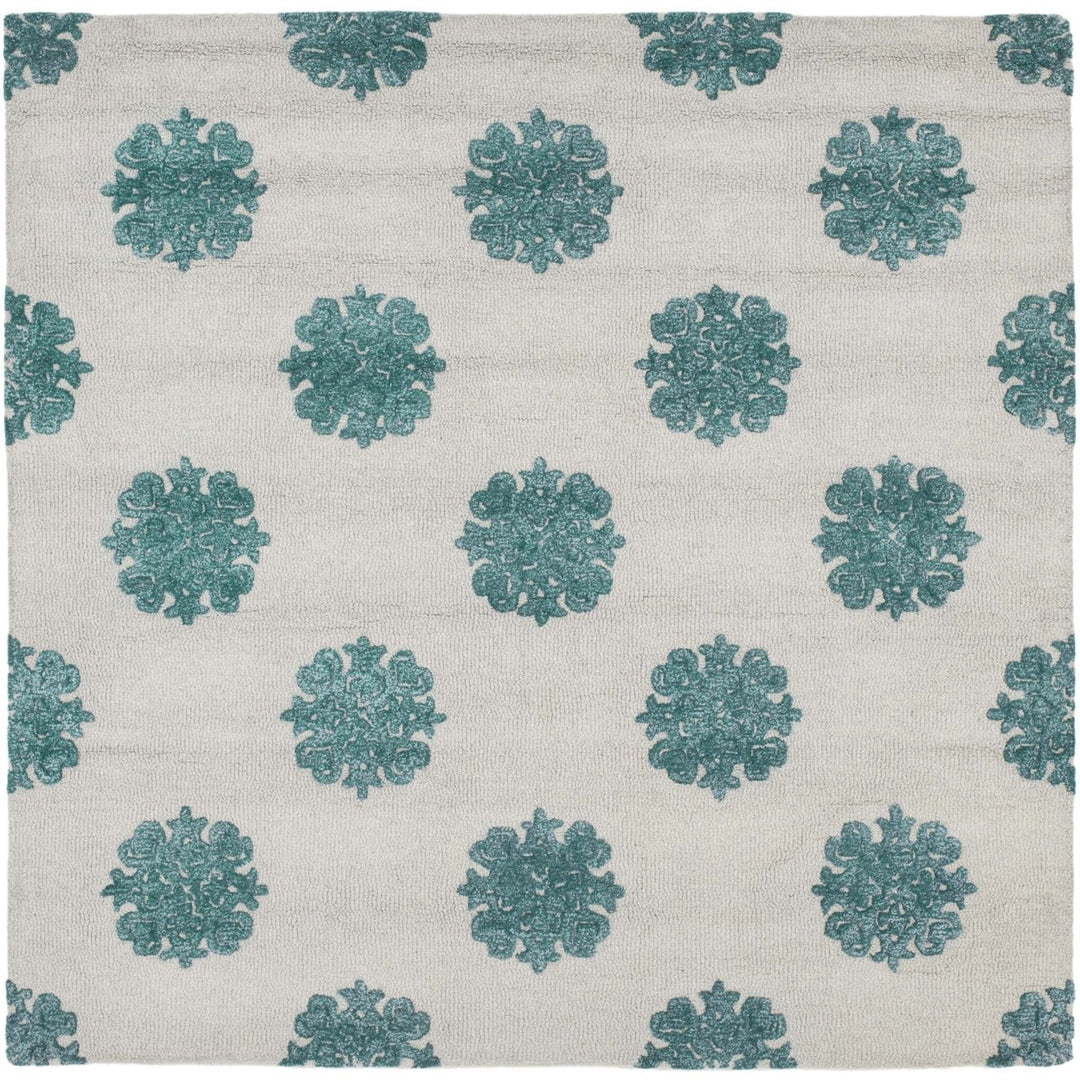 SAFAVIEH Soho SOH213A Handmade Ivory / Light Blue Rug Image 1