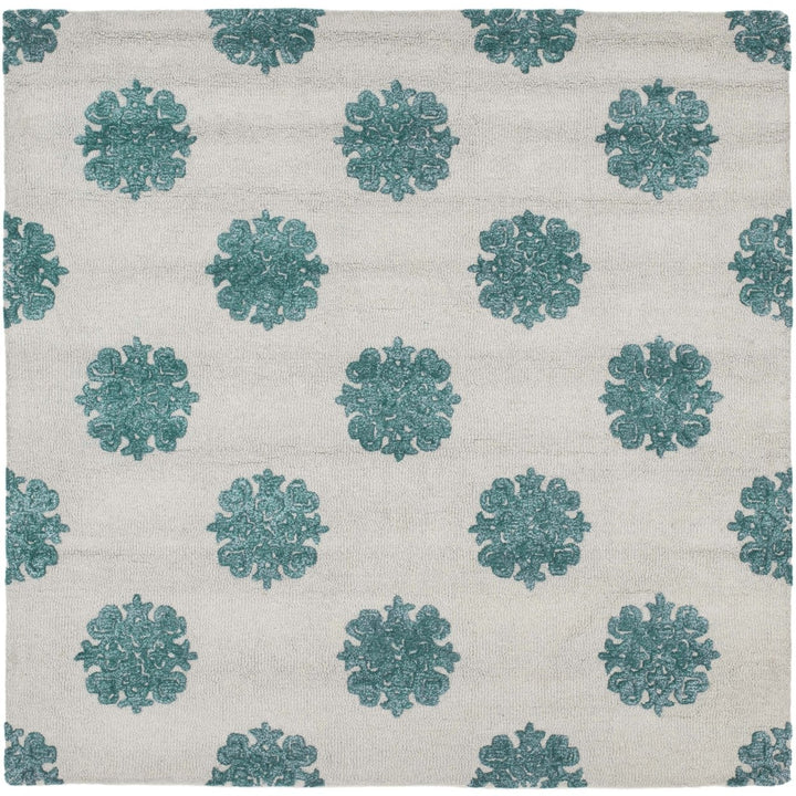 SAFAVIEH Soho SOH213A Handmade Ivory / Light Blue Rug Image 1