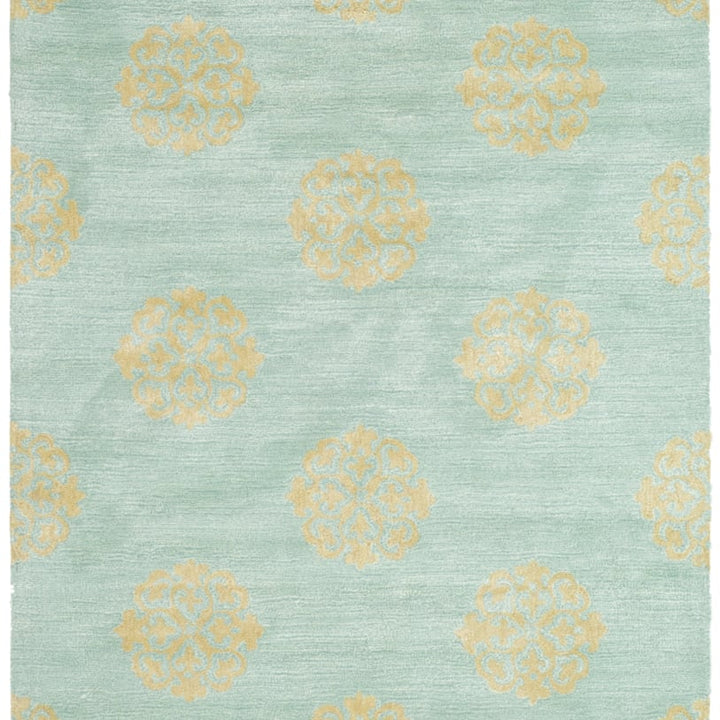 SAFAVIEH Soho Collection SOH424A Handmade Turquoise Rug Image 1