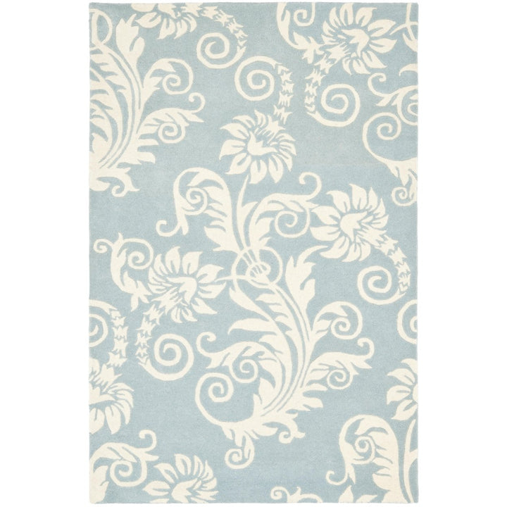 SAFAVIEH Soho Collection SOH765A Handmade Blue/Ivory Rug Image 1