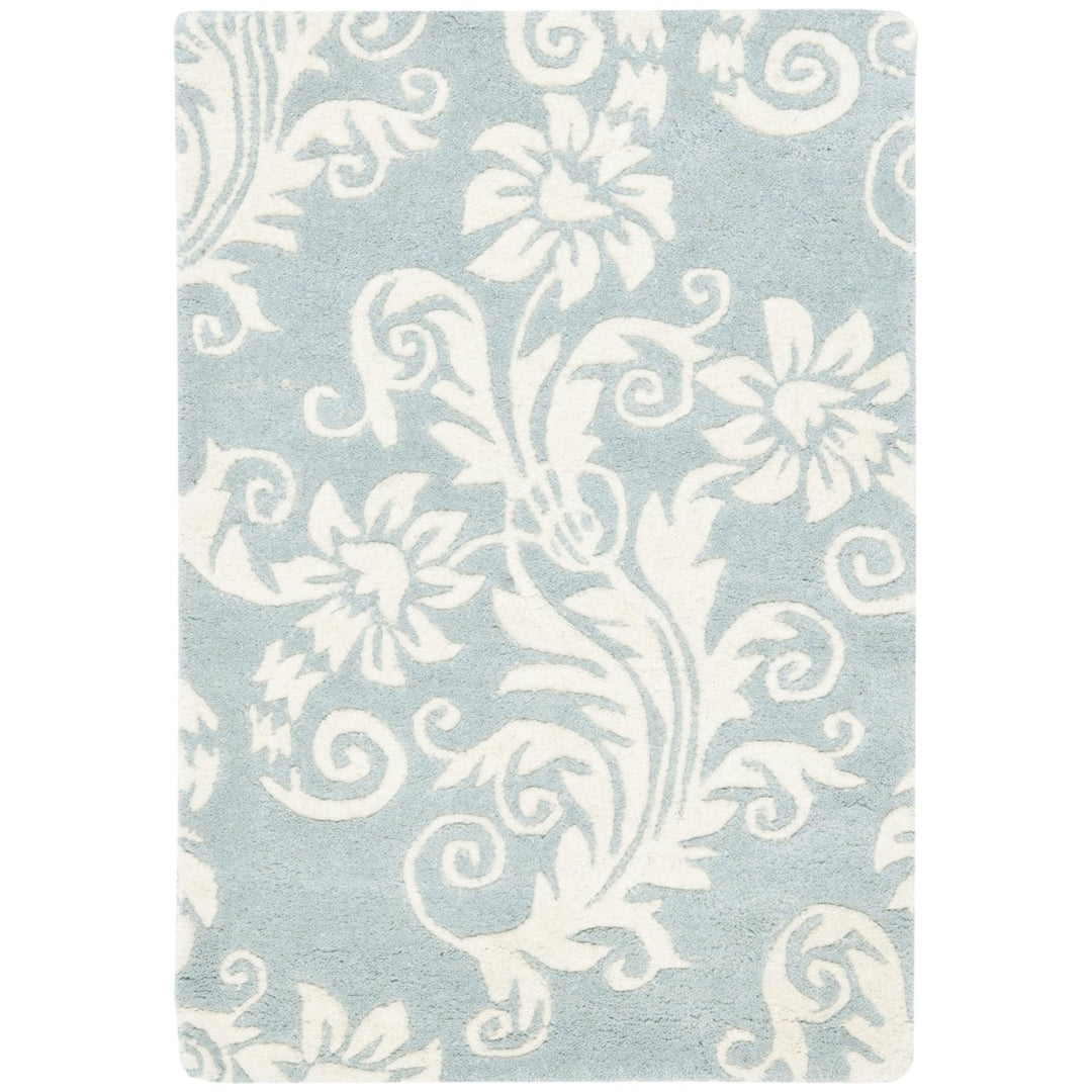 SAFAVIEH Soho Collection SOH765A Handmade Blue/Ivory Rug Image 1