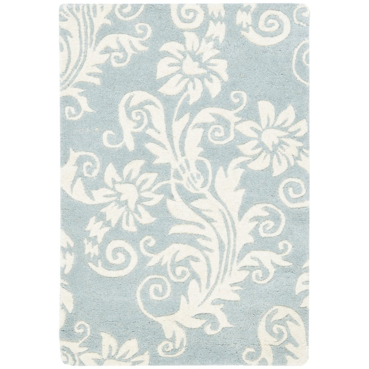 SAFAVIEH Soho Collection SOH765A Handmade Blue/Ivory Rug Image 1