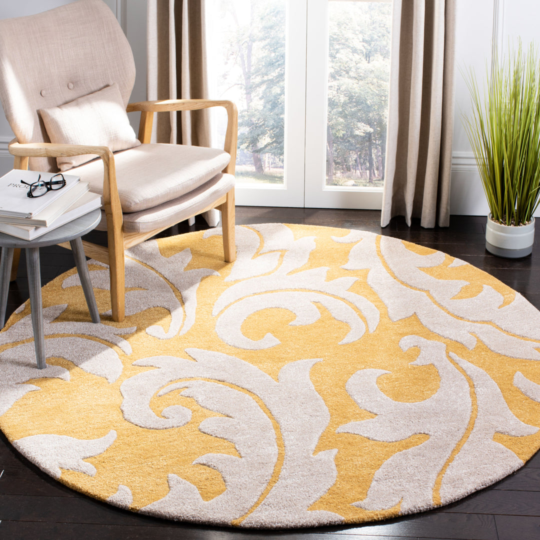 SAFAVIEH Soho Collection SOH841A Handmade Gold/Ivory Rug Image 10