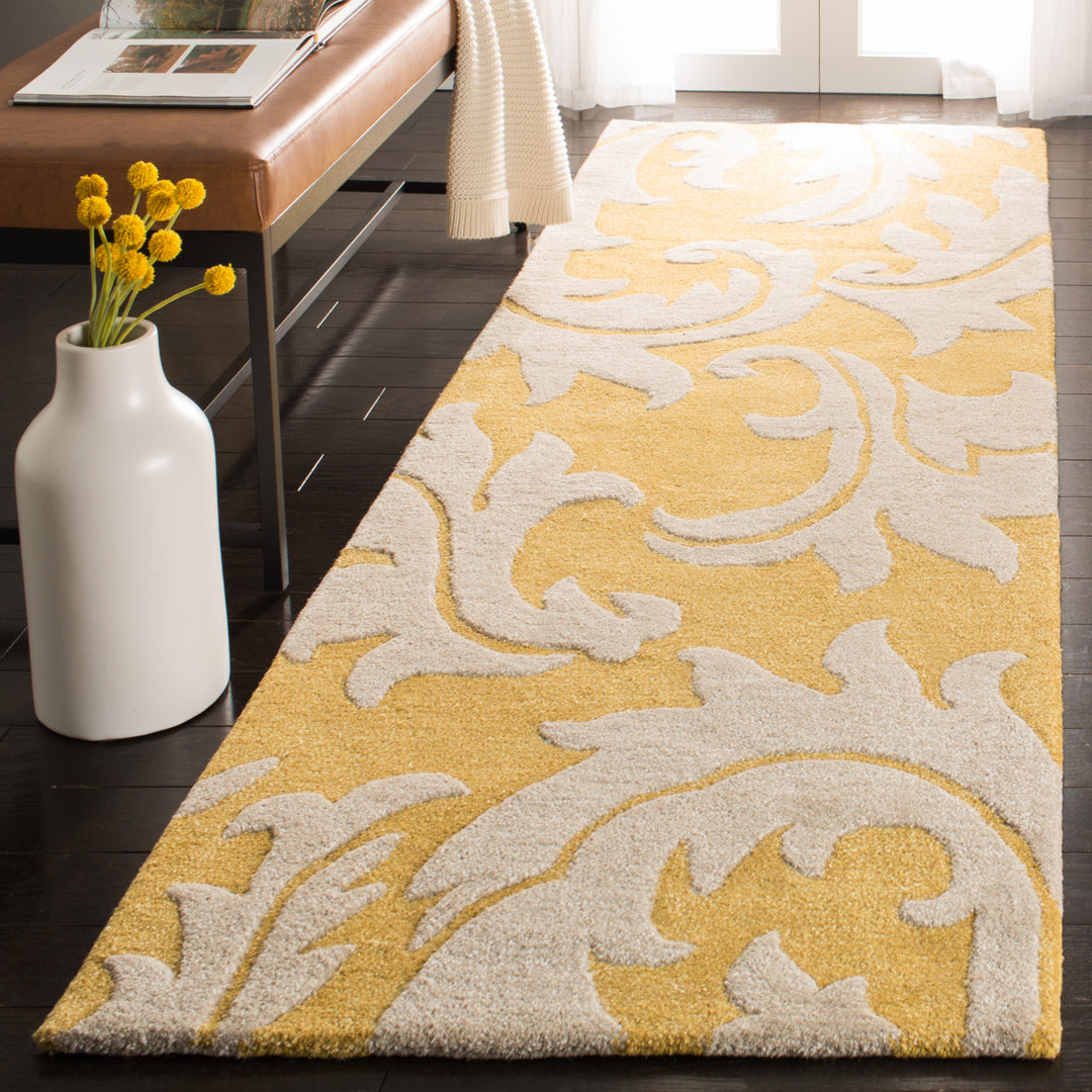 SAFAVIEH Soho Collection SOH841A Handmade Gold/Ivory Rug Image 11