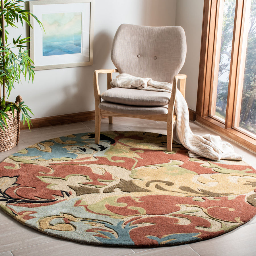 SAFAVIEH Soho Collection SOH846A Handmade Rust/Multi Rug Image 1