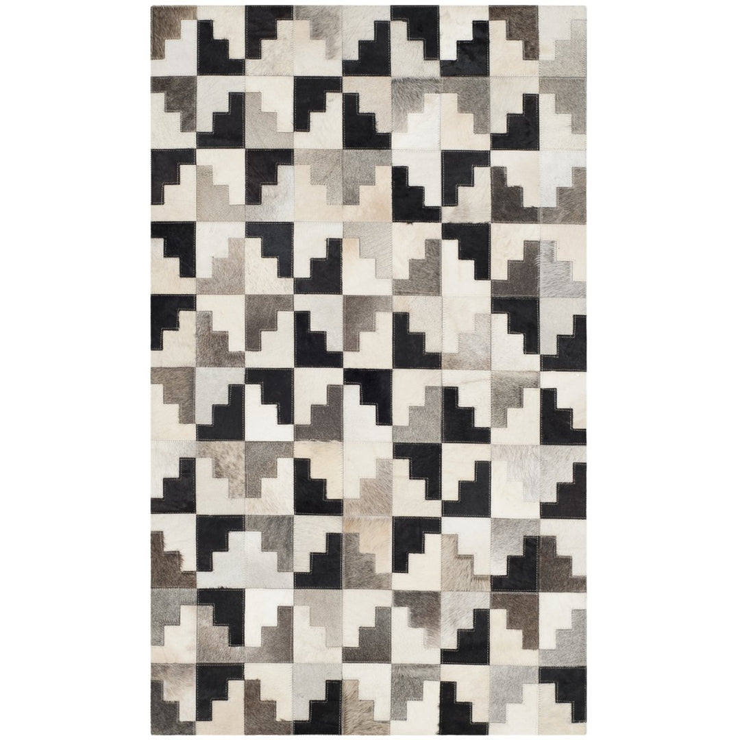 SAFAVIEH Studio Leather STL172A Ivory / Black Rug Image 1