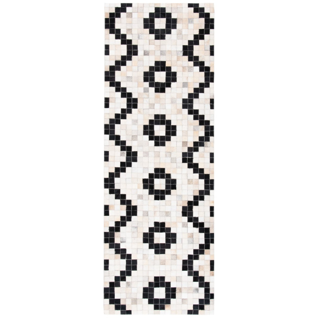 SAFAVIEH Studio Leather STL811A Ivory / Black Rug Image 1