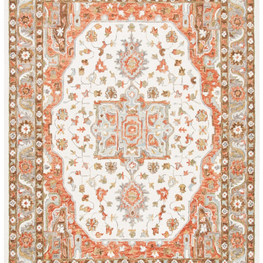 SAFAVIEH Trace Collection TRC523A Handmade Ivory/Red Rug Image 1