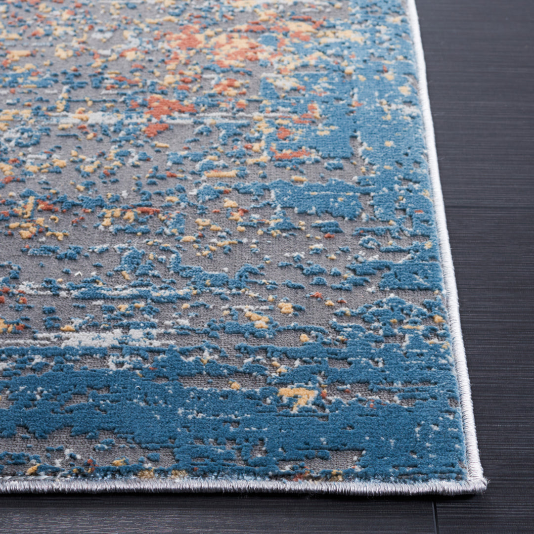 SAFAVIEH Vogue Collection VGE210A Ivory / Blue Rust Rug Image 3