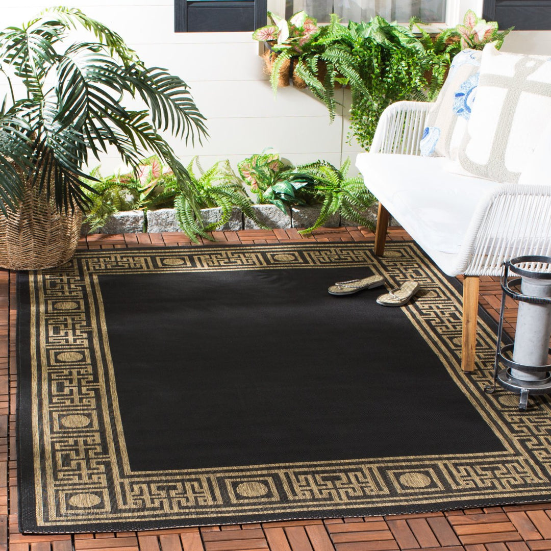 SAFAVIEH Indoor Outdoor CY5143G Courtyard Black / Coffee Rug Image 1