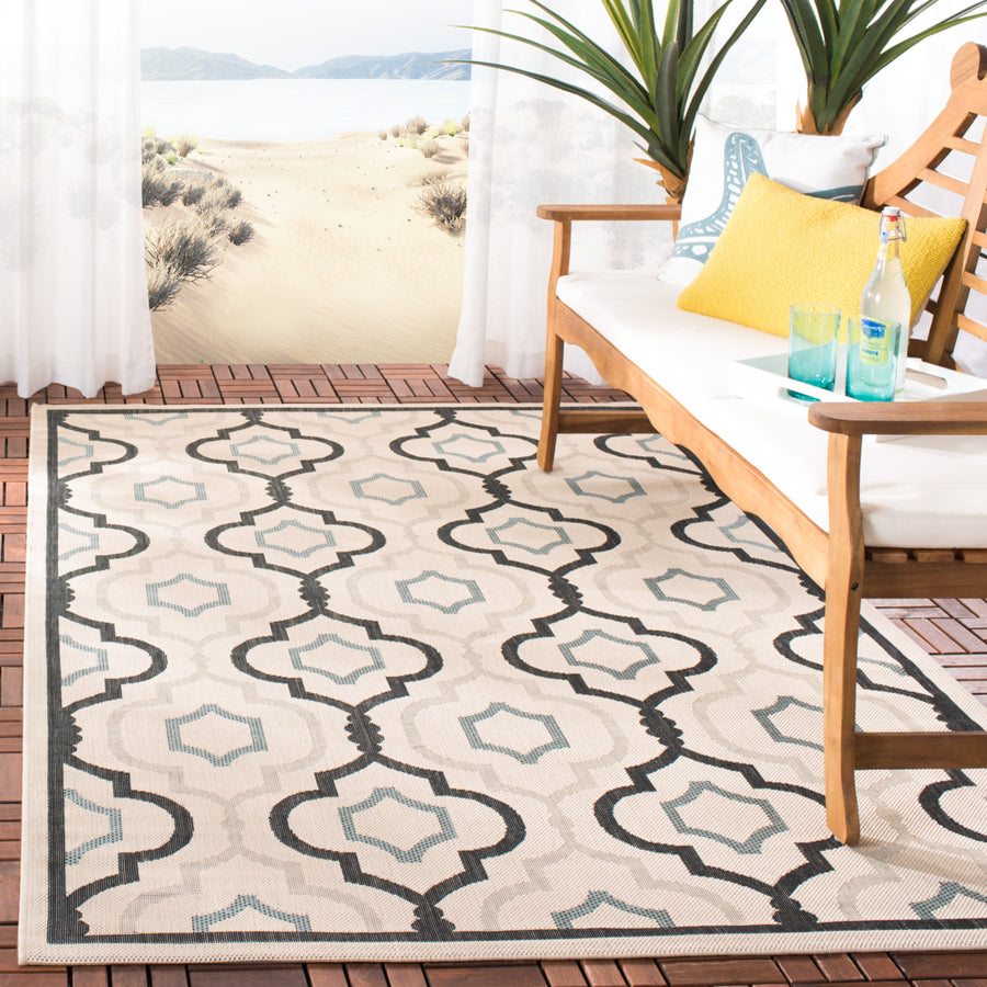SAFAVIEH Outdoor CY7938-256A18 Courtyard Ivory / Black Rug Image 1