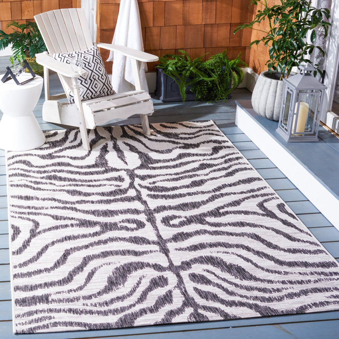 SAFAVIEH Outdoor CY8444-53712 Courtyard Ivory / Black Rug Image 1