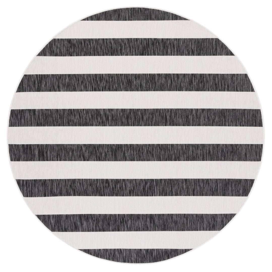 SAFAVIEH Outdoor CY8812-53712 Courtyard Ivory / Black Rug Image 1