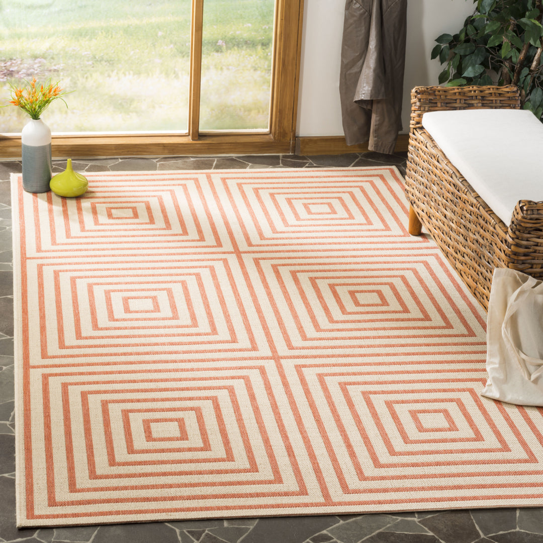 SAFAVIEH Outdoor LND123R Linden Collection Cream / Rust Rug Image 1