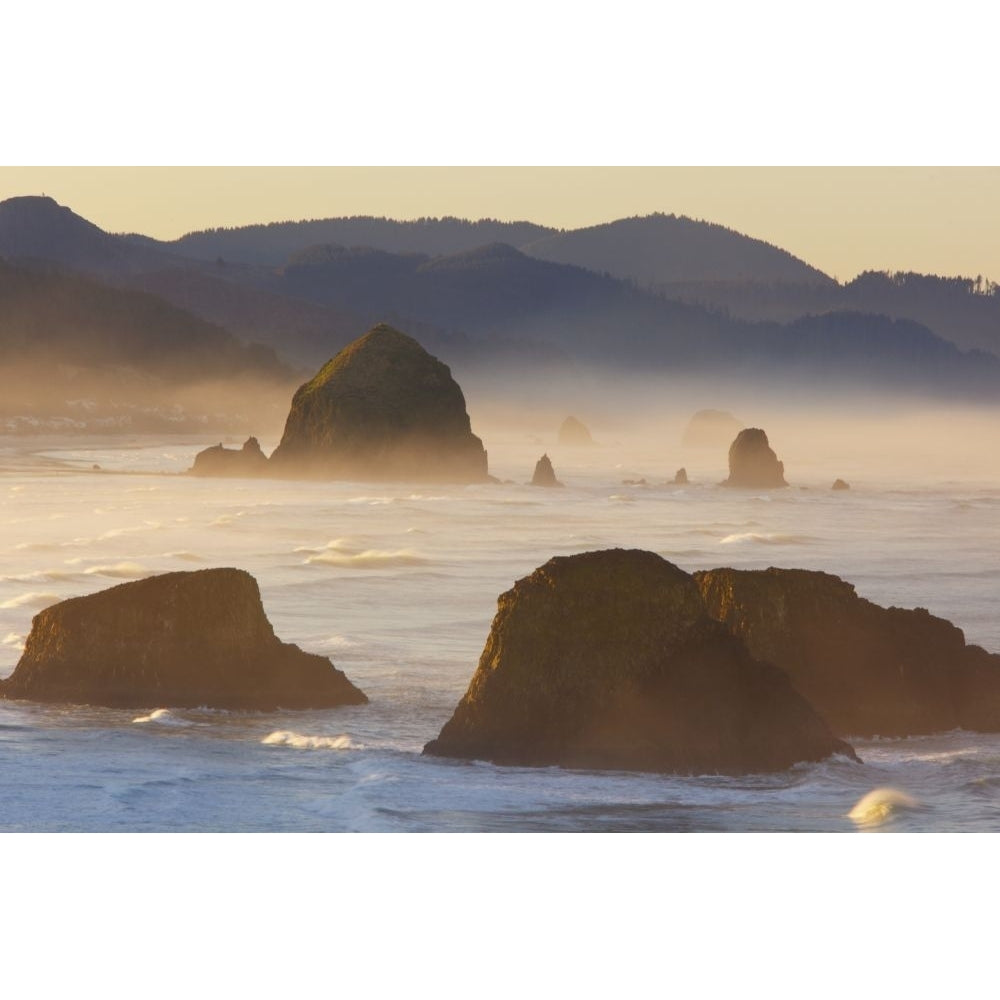 Sunrise and morning fog add beauty to Cannon Beach and Haystack Rock from Ecola State Park; Oregon United States of Image 1