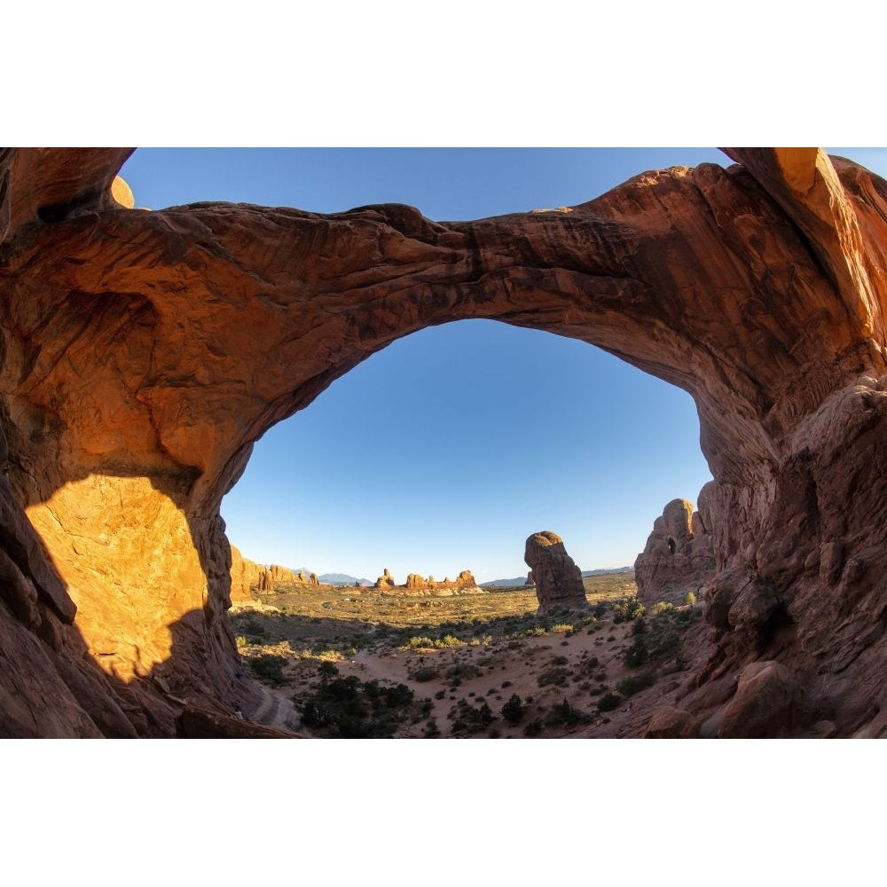 The view through Double Arch in Arches National Park near Moab in Utah. Poster Print by Loop Images Ltd. (20 x 13) Image 1